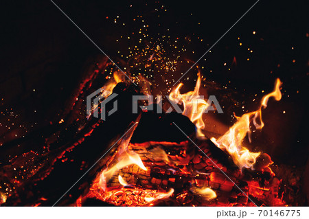 burning fire logs with sparks in the fireplace burning fire logs with sparks in the fireplace 70146775