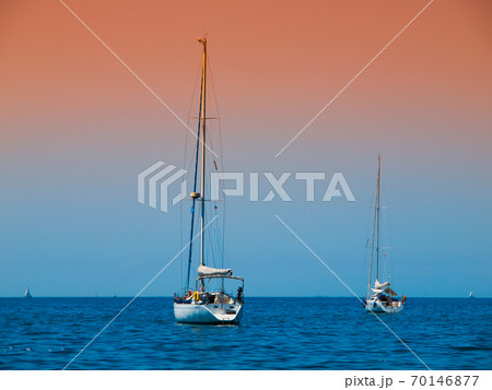 Two anchoring yachts 70146877