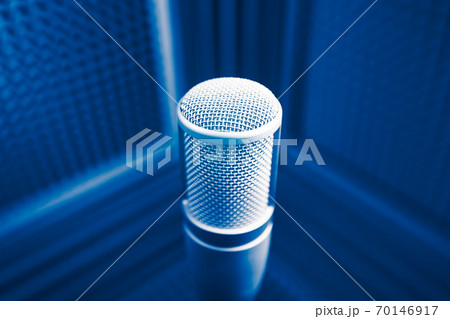 professional microphone in sound recording studio, blue acoustic foam background professional microphone in sound recording studio, blue acoustic foam background 70146917