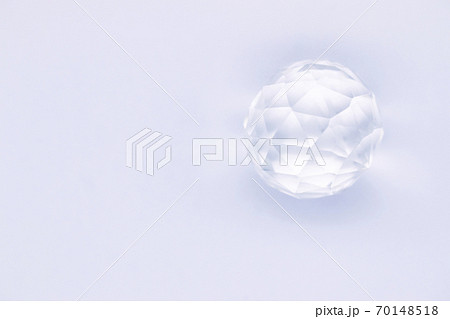 Faceted sphere, sparkling crystal on white background. Glass object with light refraction Faceted sphere, sparkling crystal on white background. Glass object with light refraction 70148518