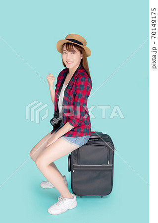 Beautiful young asian woman sitting on luggage smile and travel summer trip for abroad in vacation. Beautiful young asian woman sitting on luggage smile and travel summer trip for abroad in vacation. 70149175