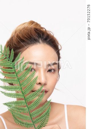 Beautiful Asian young woman touching soft cheek smile with clean fresh skin Happiness and cheerful  70152276