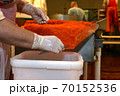 Preparing salmon caviar in the fishing processing plant 70152536