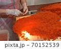 Preparing salmon caviar in the fishing processing plant 70152539