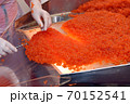 Preparing salmon caviar in the fishing processing plant 70152541