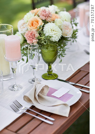 Georgeous wedding table decorated with flowers Georgeous wedding table decorated with flowers 70157287