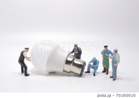 Business creative idea, power or energy generator concept, miniature people 70160010
