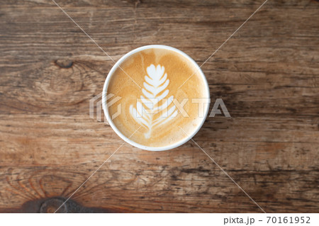 Topviews of a Late coffee cup on old wooden table background 70161952