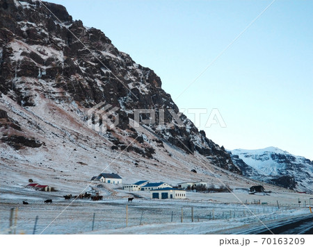 A lonely house at the foot of the mountains in Iceland. Incredible landscapes of nature. Life for a social phobia 70163209
