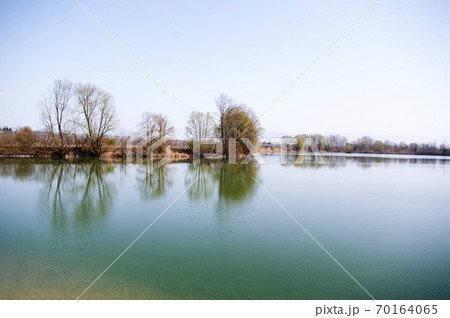 Green lake in spring time. clear sky,copy space. Nature backdrop. Green lake in spring time. clear sky,copy space. Nature backdrop. 70164065