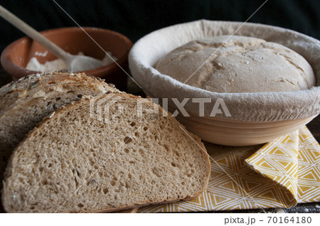 sourdough dough in proofing basket , whole wheat recipe. Rye flour bread slices. Home baked seed bread. 70164180