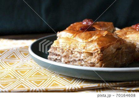 Sweet baklava, turkish food, dessert with walnuts and sugar syrup. Home made bakery. Sweet baklava, turkish food, dessert with walnuts and sugar syrup. Home made bakery. 70164608