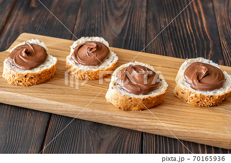 Slices of baguette with chocolate paste Slices of baguette with chocolate paste 70165936