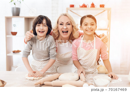 Young grandmother with small grandchildren.  70167469