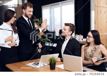 The head of company talks with other employees. The head of company talks with other employees. 70168636