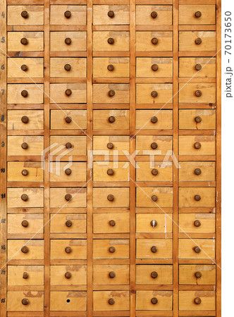 Old wooden cabinet with drawers Old wooden cabinet with drawers 70173650