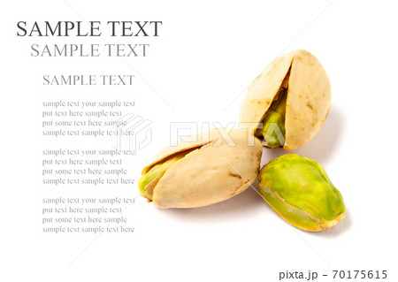 Pistachio nuts on a white background Pistachio nuts on a white background 70175615