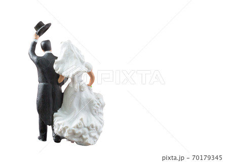 Miniature people wedding , bride and groom couple isolated on white background with clipping path Miniature people wedding , bride and groom couple isolated on white background with clipping path 70179345
