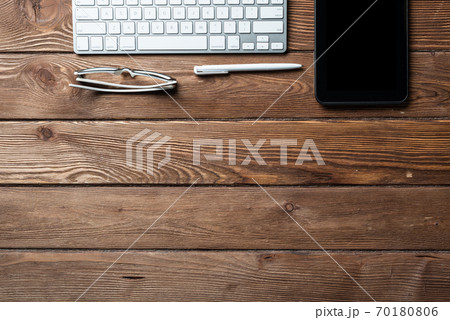 Top view of office workspace with gadgets 70180806