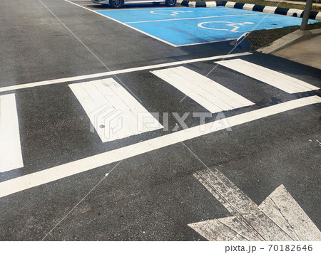 Zebra crossing for pedestrians on the road. Made of thermoplastic material and has light-reflective particles. Provides safety advantages to pedestrians. 70182646