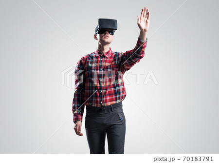 Guy in mask experiencing virtual reality as new entertainment device 70183791