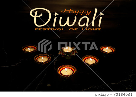 Happy Diwali day. Colorful traditional oil lamp diya on dark background. 70184031