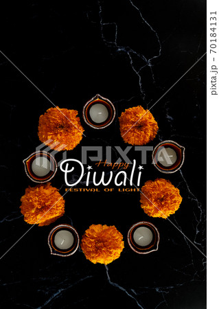 Happy Diwali day. Colorful traditional oil lamp diya on dark background. Happy Diwali day. Colorful traditional oil lamp diya on dark background. 70184131