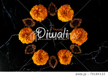 Happy Diwali day. Colorful traditional oil lamp diya on dark background. Happy Diwali day. Colorful traditional oil lamp diya on dark background. 70184132
