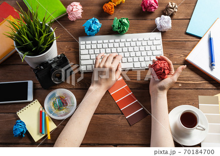 Close up woman hands with colorful paper balls 70184700
