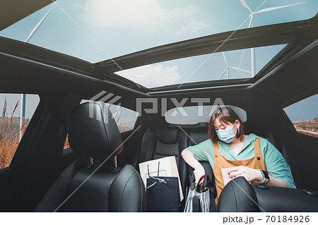 new normal and social distancing concept with asian woman shopping by drive thru and wear protective mask 70184926