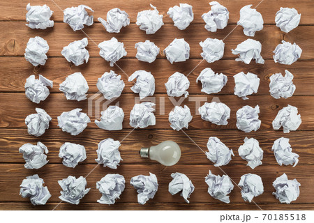 Ideological concept with wastepaper light bulb on wooden table 70185518