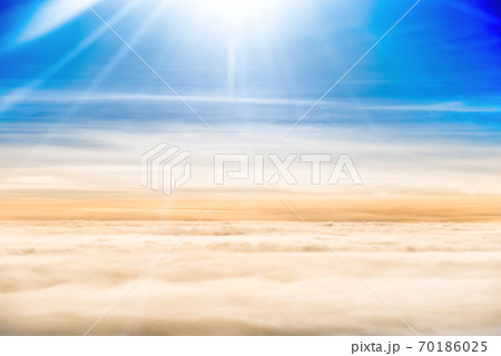 Beautiful airview with blue sky, white clouds and sunrays Beautiful airview with blue sky, white clouds and sunrays 70186025