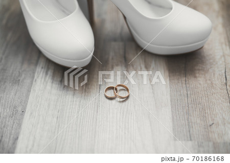 White stylish wedding shoes for bride. Close-up 70186168