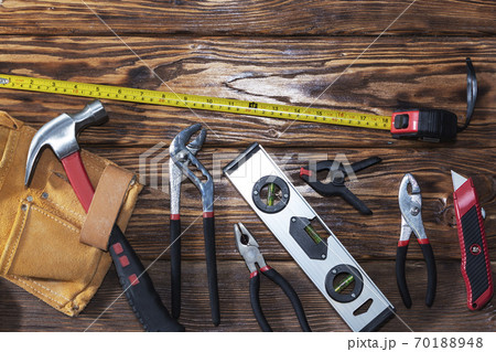 Close up tools on a wooden background. 70188948
