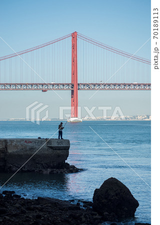 Lisbon - Portugal - 29 September 2020 - panorama of the famous 25th April suspension bridge on the tage river 70189113