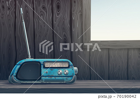 Old retro radio receiver on a wooden table background. Dark room with light window through wood wall and blue vintage antique device, audio tuner, sound speaker. Vector digital illustration. Old retro radio receiver on a wooden table background. Dark room with light window through wood wall and blue vintage antique device, audio tuner, sound speaker. Vector digital illustration. 70190042