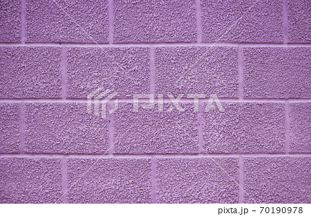purple wall of the house on the street. the plaster has a texture and is covered with paint. beautiful background purple wall of the house on the street. the plaster has a texture and is covered with paint. beautiful background 70190978
