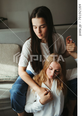 Two young women in love embracing. Relationships Two young women in love embracing. Relationships 70192164