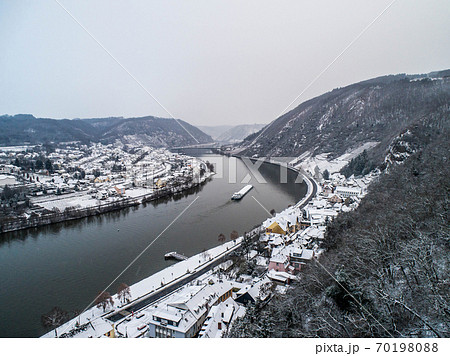 Seasons Concept winter Aerial view of the mosel village Brodenbach in Germany on a misty day Seasons Concept winter Aerial view of the mosel village Brodenbach in Germany on a misty day 70198088