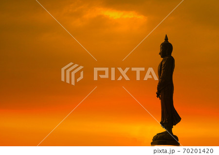 Sunday Buddha and sunset orange cloud on sky on the Asanha bucha day Sunday Buddha and sunset orange cloud on sky on the Asanha bucha day 70201420