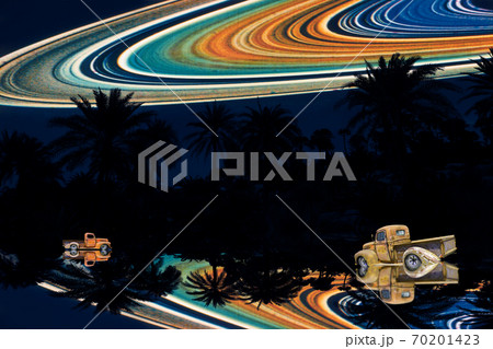 reflection of silhouette dry tree and car in the field and Saturn ring on night sky reflection of silhouette dry tree and car in the field and Saturn ring on night sky 70201423