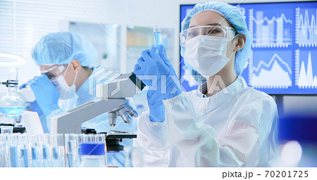asian scientist take test tube 70201725