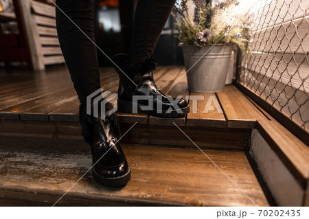 Close-up of fashionable black patent leather warm Close-up of fashionable black patent leather warm 70202435