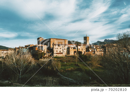 A cityscape of the medieval village of Santa Pau 70202810