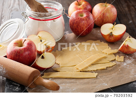 Cooking baking concept. Making rustic American style apple pie, view on table with ingredients. 70203592
