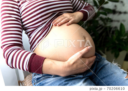 Vertical Smiling, Pensive Pregnant Blond Woman Holding Naked Belly, Wear  Red Pajamas, Resting and Relaxing. New Member Stock Image - Image of  mother, healthy: 266228127