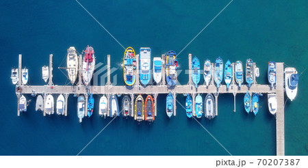 Panoramic Aerial view on boats moored in the pier, drone shot directly above. Panoramic Aerial view on boats moored in the pier, drone shot directly above. 70207387