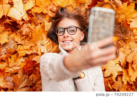 Top view on a young positive woman in a trendy Top view on a young positive woman in a trendy 70209227