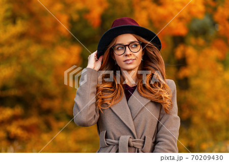 Pretty young hipster woman with a stylish 70209430