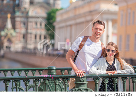 Family at the summer waterfront in Saint Petersburg outdoors Family at the summer waterfront in Saint Petersburg outdoors 70211308